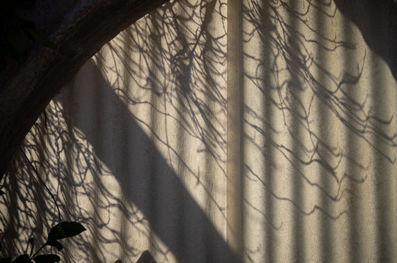 A Covered Window With Shadows